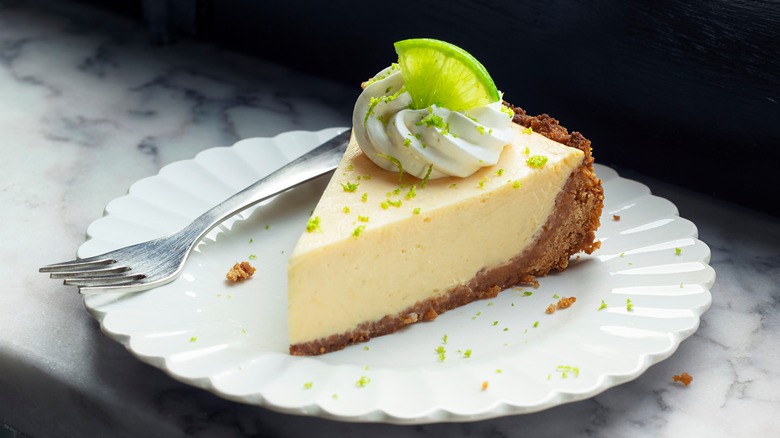 slice of key lime pie on plate