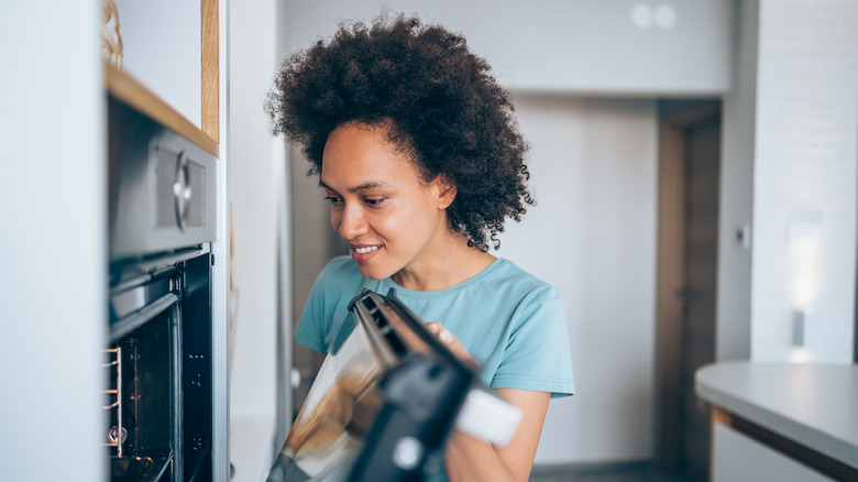 Person looking into oven