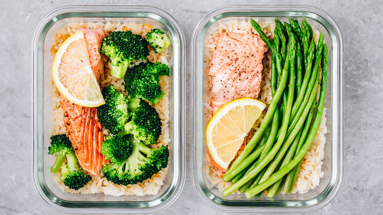 Two salmon meals prepared and portioned into individual storage containers