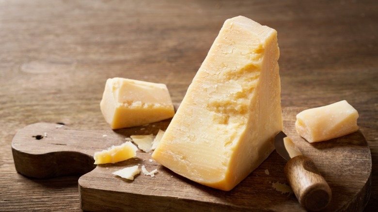 Parmesan wedge on cutting board