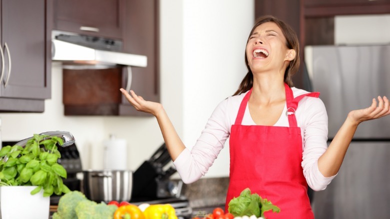 Stressed woman in kitchen