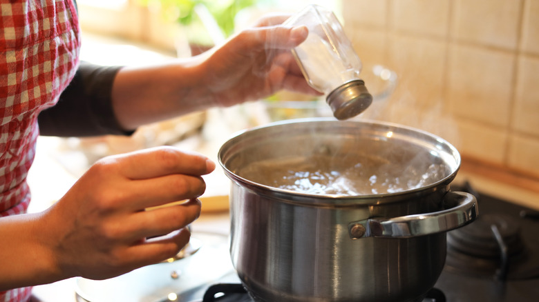 Adding salt to boiling water