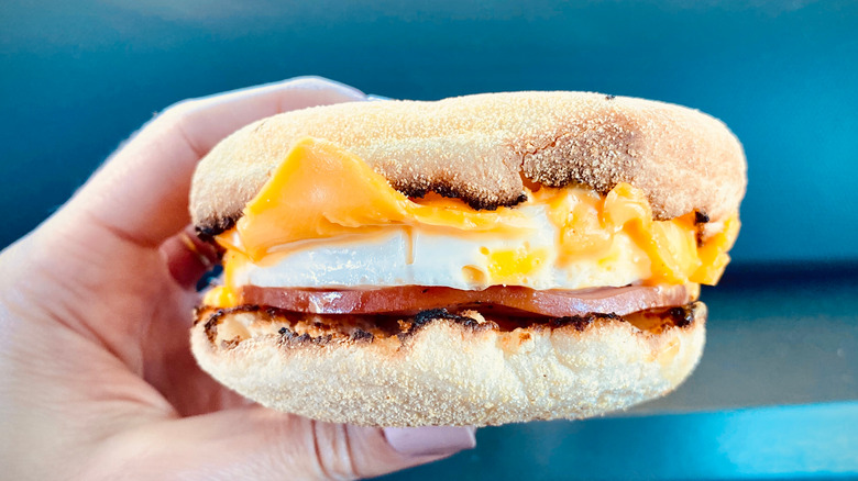 hand holding Egg McMuffin