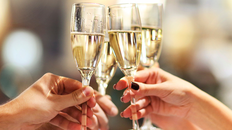 friends toasting with Champagne