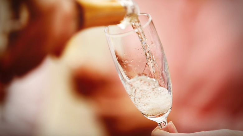 pouring Champagne into glass