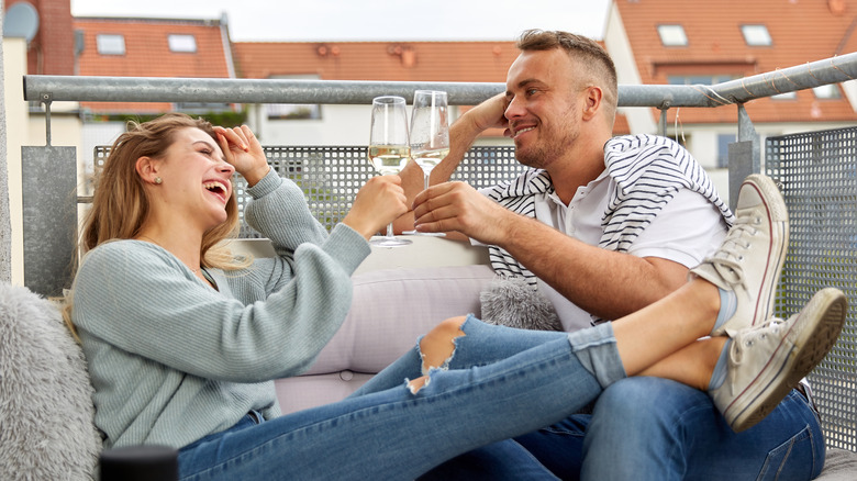 couple casually toasting with Champagne
