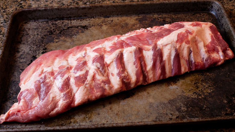 Raw rack of baby back ribs