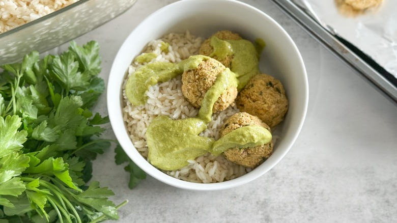 baked falafel over rice with sauce