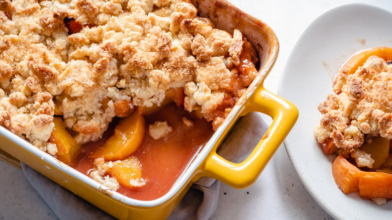 Peach cobbler in baking dish