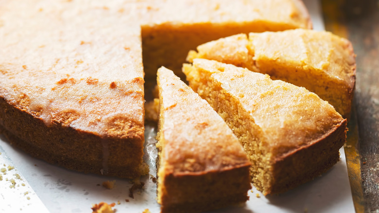 Three slices cut from yellow cake