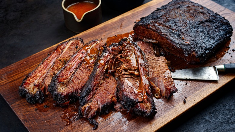 Beef brisket sliced on cutting board