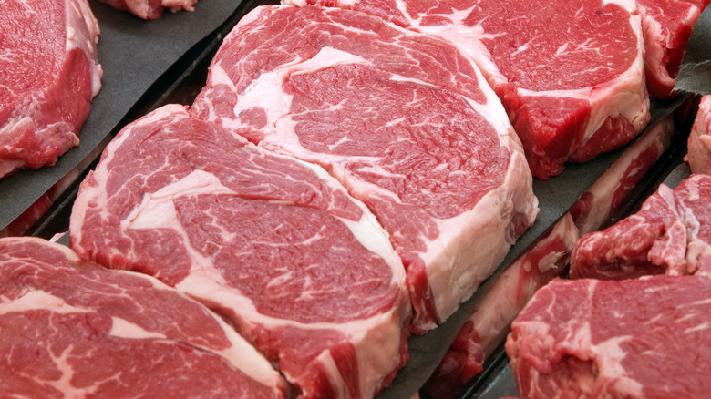 Raw steak on display at a grocery store