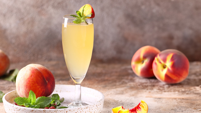 Bellini cocktail with peaches