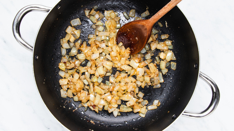 diced onion frying in pan 