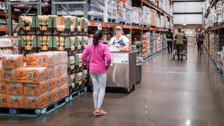 Costco worker giving free sample to a customer