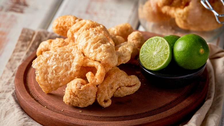 crispy pork rind with lime on platter