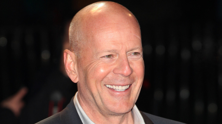 Bruce Willis smiling at press event