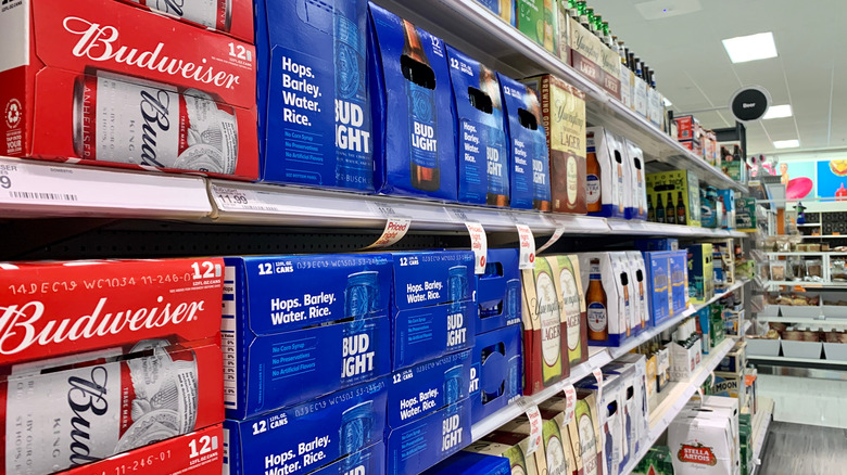 cases of beer on shelves in a store