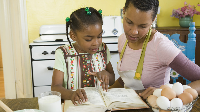 Two people looking at recipe