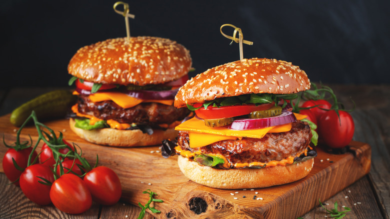 Closeup of loaded cheeseburgers