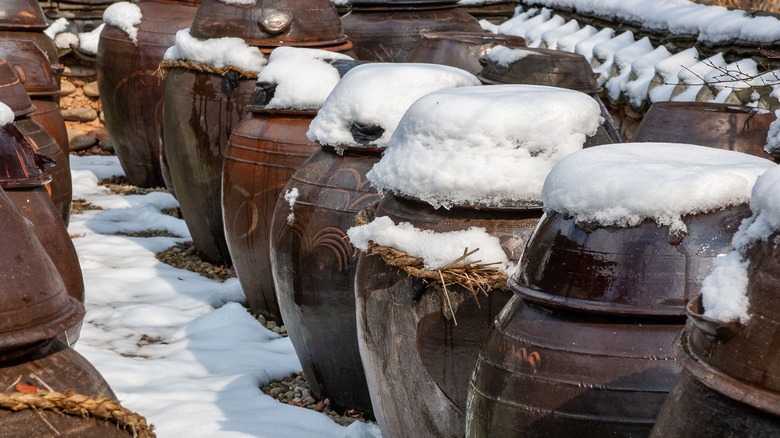kimchi pots covered in snow