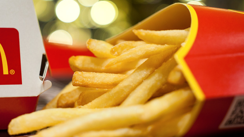 Fries spilling out of container