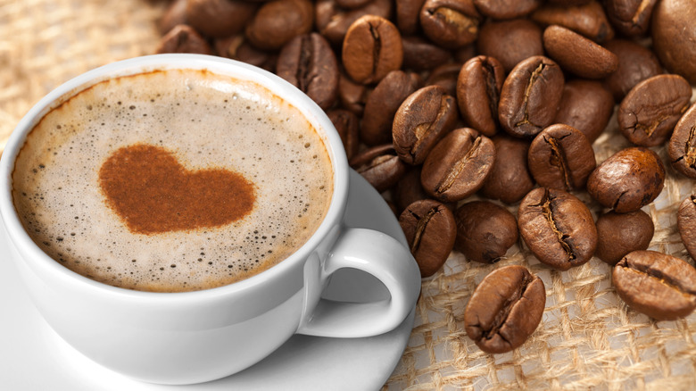 Coffee beans with cup