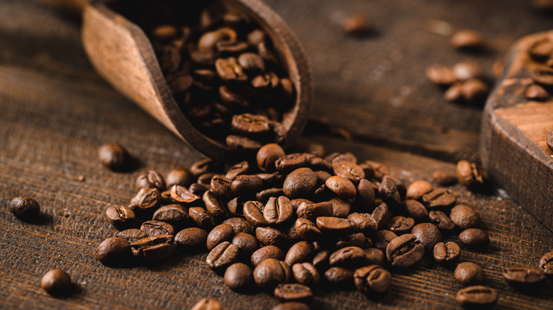 Coffee beans piled with scoop