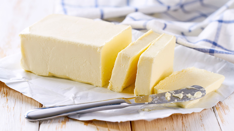 Stick of butter with slices