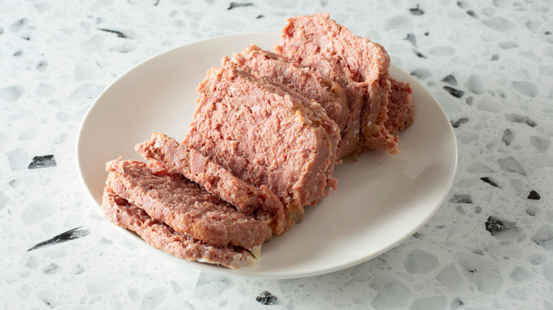 A plate of canned corned beef cooked and on a table