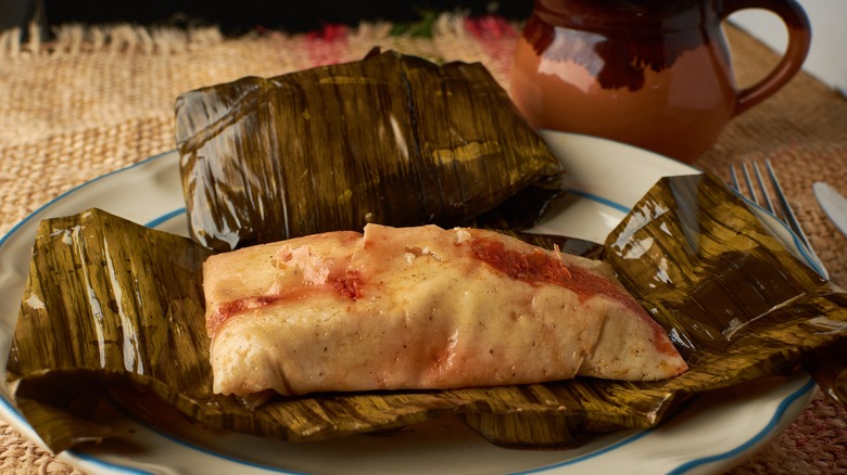 Ranchero tamales wrapped in banana leaves