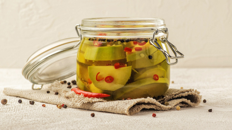pickled avocado in glass jar