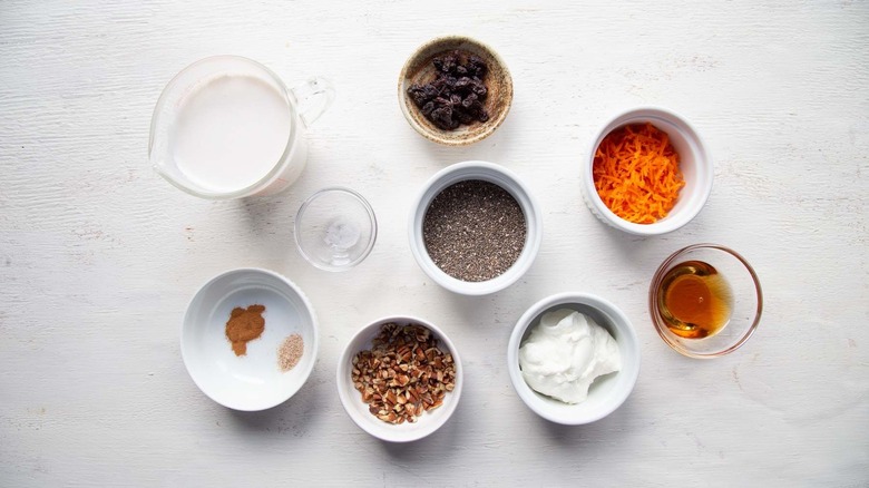 Ingredients for carrot cake chia pudding in various bowls