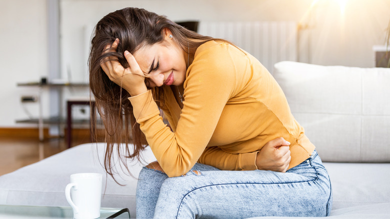 woman feeling sick from cassava 