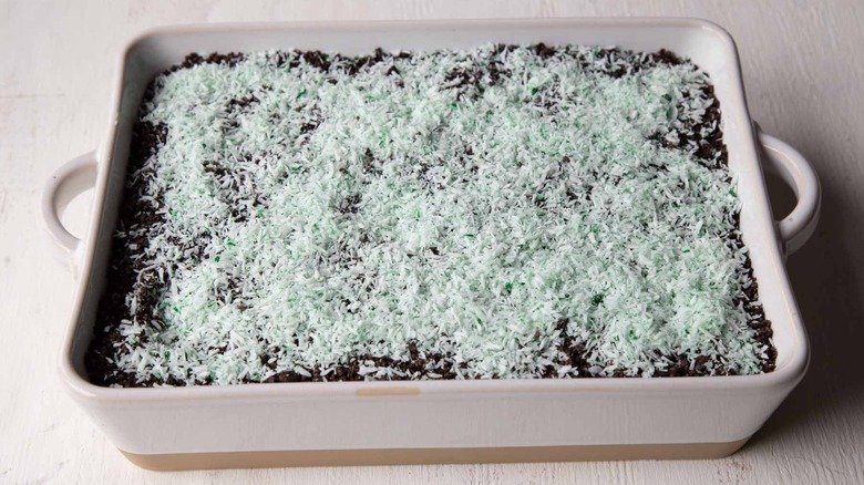 dessert with shredded coconut topping in baking dish