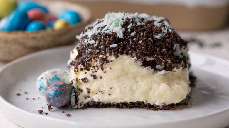 piece of dirt cake with chocolate eggs on plate