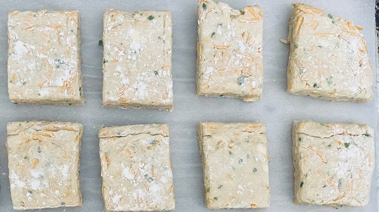 cheddar-scallion biscuits on pan
