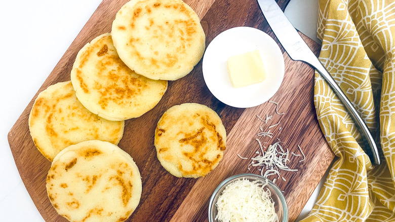 cheese stuffed arepas on platter 