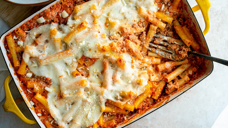cheesy baked ziti in dish 