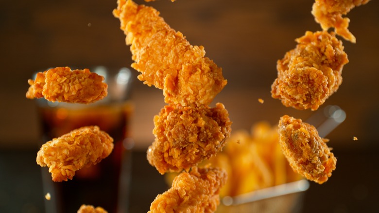 fried chicken in mid air