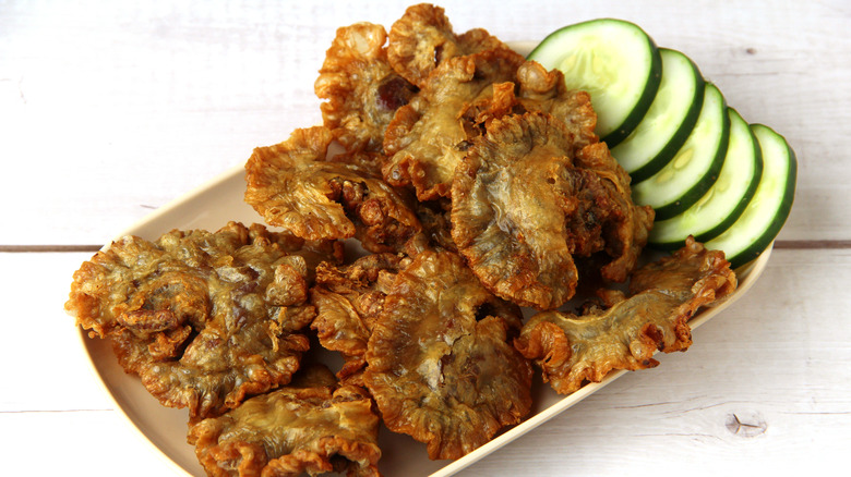 plate of chicharon bulaklak with cucumber