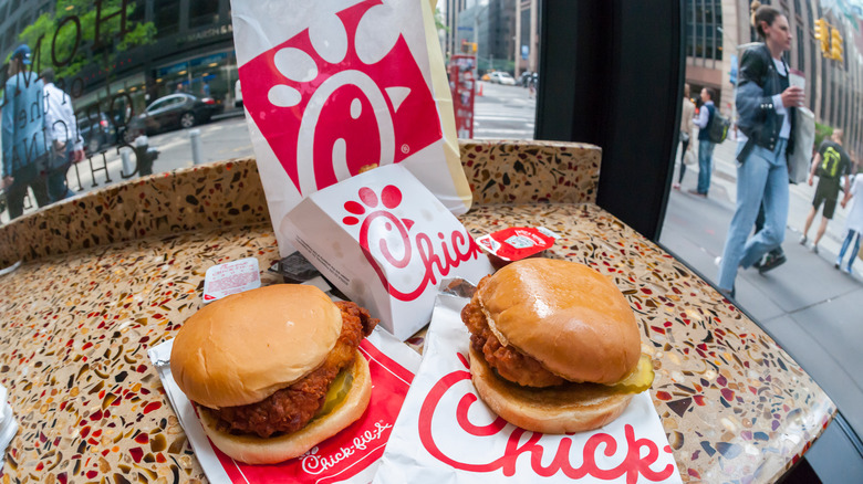 two chick-fil a chicken sandwiches on a table