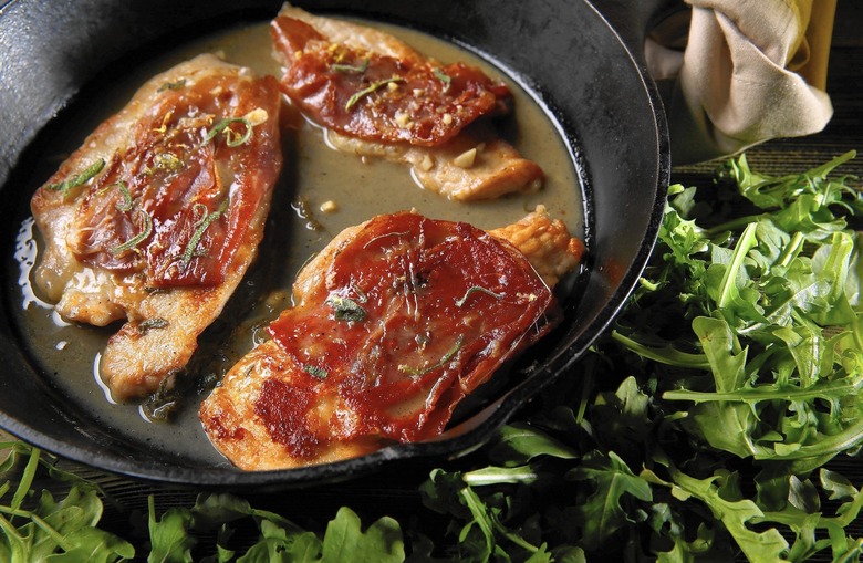 Chicken cutlets saltimbocca-style with sage butter pan sauce and arugula