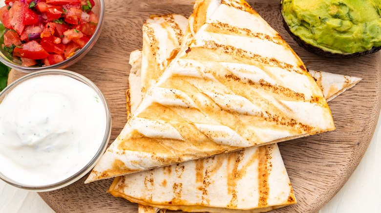 Quesadillas with sour cream, guacamole, and pico