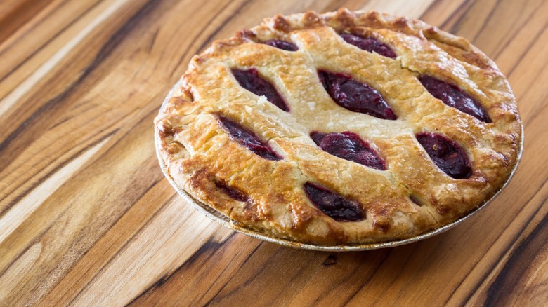 chokecherry pie on wood counter