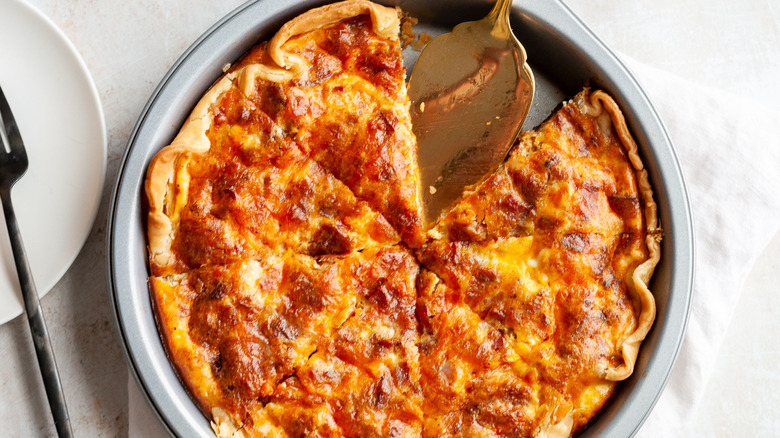 bacon and cheddar quiche in dish