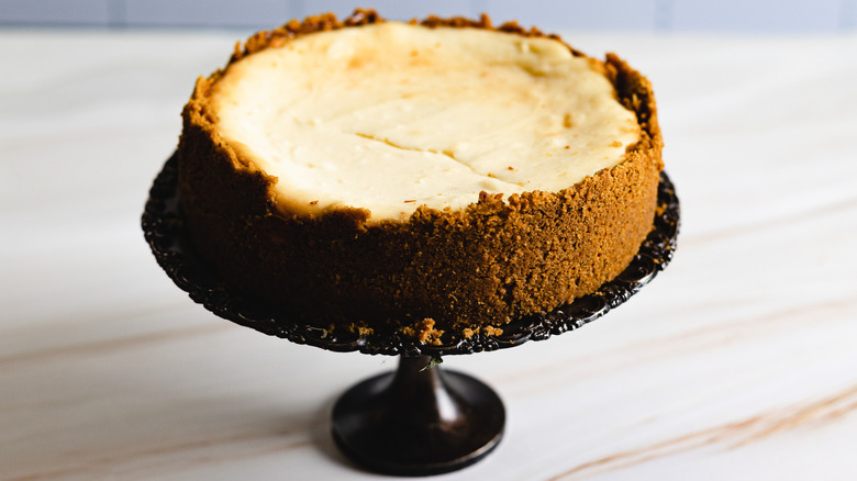 baked cheesecake on cake stand
