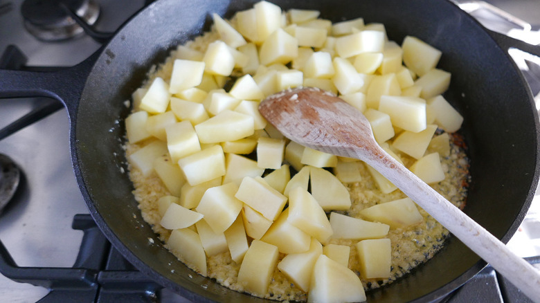 cubed potatoes in skillet 