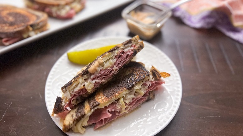 sliced reuben sandwich on plate