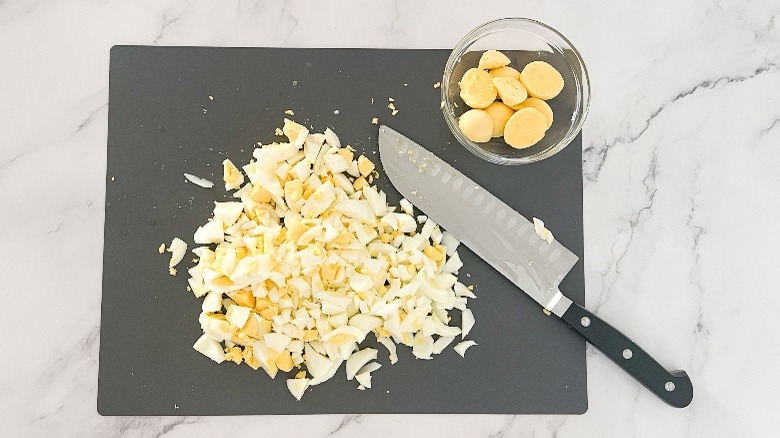 chopped eggs and reserved egg yolks